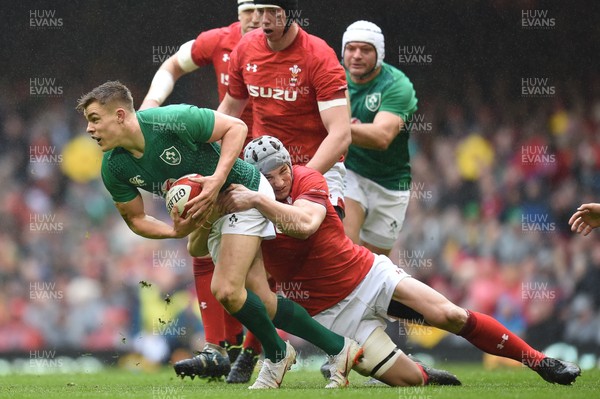 160319 - Wales v Ireland - Guinness Six Nations - Garry Ringrose of Ireland is tackled by Jonathan Davies of Wales 
