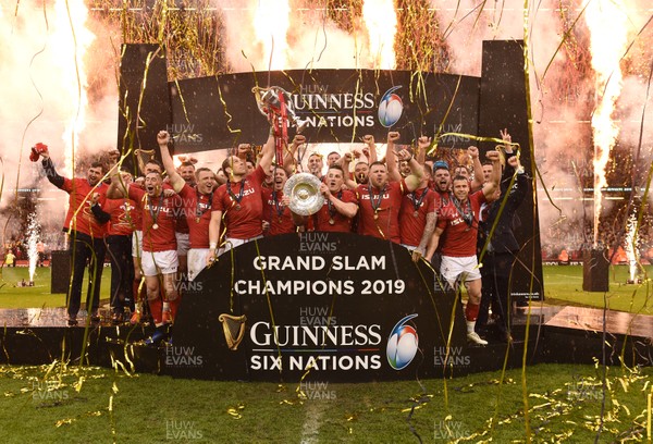 160319 - Wales v Ireland - Guinness Six Nations -  Alun Wyn Jones lifts the Six Nations Championship trophy and Jonathan Davies raises the Triple Crown