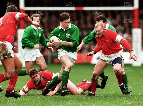 180395 - Wales v Ireland - Five Nations Championship -  Gabriel Fulcher of Ireland gets past Neil Jenkins (rt)