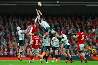 220225 - Wales v Ireland - Guinness Six Nations - Ellis Mee of Wales competes for the ball with Tadhg Beirne of Ireland