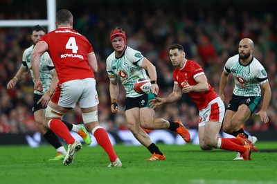 220225 - Wales v Ireland - Guinness Six Nations - Tomos Williams of Wales passes the ball to teammate Will Rowlands