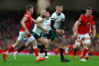 220225 - Wales v Ireland - Guinness Six Nations - Sam Prendergast of Ireland runs with the ball