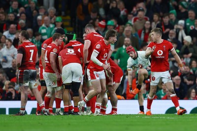 220225 - Wales v Ireland - Guinness Six Nations - Ellis Mee of Wales talks to teammate Gareth Anscombe