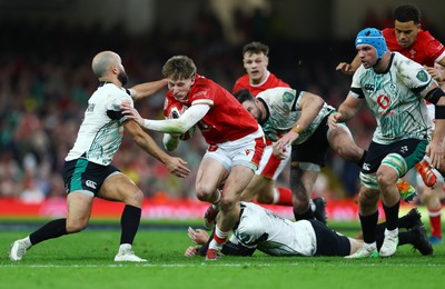 220225 - Wales v Ireland - Guinness Six Nations - Ellis Mee of Wales is tackled by Jamison Gibson-Park of Ireland