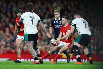 220225 - Wales v Ireland - Guinness Six Nations - Tomos Williams of Wales passes the ball whilst under pressure from Dan Sheehan of Ireland