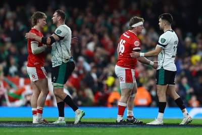 220225 - Wales v Ireland - Guinness Six Nations - Ellis Mee of Wales, Tadhg Beirne of Ireland, Evan Lloyd of Wales and Conor Murray of Ireland shake hands at the end of the match