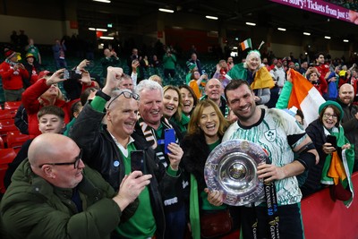 220225 - Wales v Ireland - Guinness Six Nations - Tadhg Beirne of Ireland poses for a photo with the Triple Crown Trophy