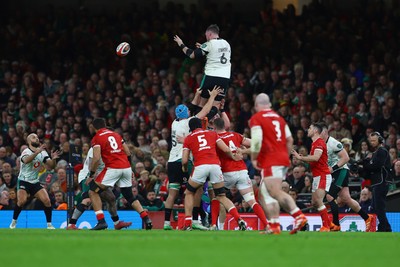 220225 - Wales v Ireland - Guinness Six Nations - Peter O'Mahony of Ireland passes the ball to teammate Jamison Gibson-Park from the line out