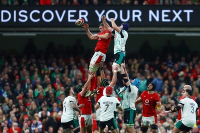 220225 - Wales v Ireland - Guinness Six Nations - Will Rowlands of Wales jumps competes with Ryan Baird of Ireland  in the line out