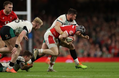 220225 - Wales v Ireland - Guinness 6 Nations Championship - Tom Rogers of Wales wins the high ball