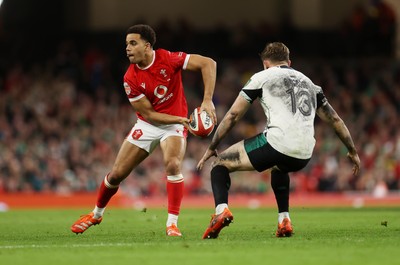 220225 - Wales v Ireland - Guinness 6 Nations Championship - Ben Thomas of Wales is challenged by Garry Ringrose of Ireland 