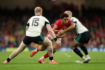 220225 - Wales v Ireland - Guinness 6 Nations Championship - Ben Thomas of Wales is tackled by Jamison Gibson-Park of Ireland 