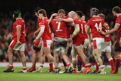 220225 - Wales v Ireland - Guinness 6 Nations Championship - Jac Morgan of Wales celebrates scoring a try with team mates