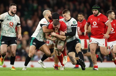 220225 - Wales v Ireland - Guinness 6 Nations Championship - Will Rowlands of Wales is tackled by Jamison Gibson-Park and Sam Prendergast of Ireland 