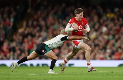 220225 - Wales v Ireland - Guinness 6 Nations Championship - Ellis Mee of Wales is tackled by Jamison Gibson-Park of Ireland 