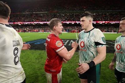 220225 - Wales v Ireland - Guinness 6 Nations Championship - Jac Morgan of Wales and Dan Sheehan of Ireland at full time