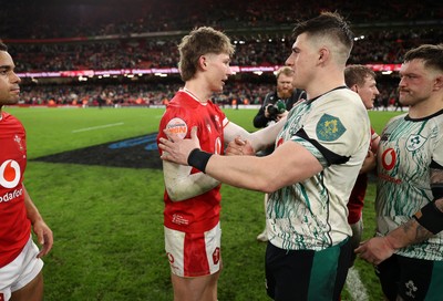 220225 - Wales v Ireland - Guinness 6 Nations Championship - Ellis Mee of Wales and Dan Sheehan of Ireland at full time