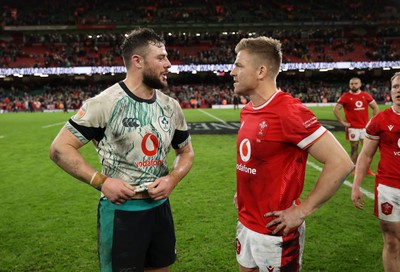 220225 - Wales v Ireland - Guinness 6 Nations Championship - Robbie Henshaw of Ireland and Gareth Anscombe of Wales at full time