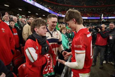 220225 - Wales v Ireland - Guinness 6 Nations Championship - Ellis Mee of Wales with family after the game