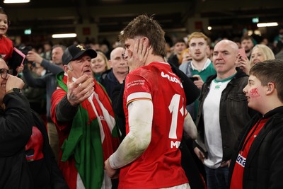 220225 - Wales v Ireland - Guinness 6 Nations Championship - Ellis Mee of Wales with family after the game