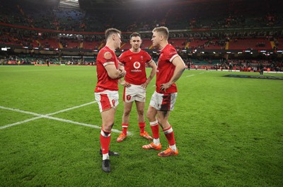 220225 - Wales v Ireland - Guinness 6 Nations Championship - Jarrod Evans, Tomos Williams and Gareth Anscombe of Wales 