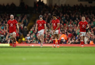 220225 - Wales v Ireland - Guinness 6 Nations Championship - WillGriff John, Tom Rogers, Ben Thomas and Gareth Anscombe of Wales 