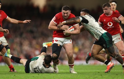 220225 - Wales v Ireland - Guinness 6 Nations Championship - Gareth Thomas of Wales is tackled by Robbie Henshaw and Bundee Aki of Ireland 