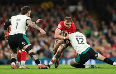 220225  Wales v Ireland, 2025 Guinness Six Nations - Tommy Reffell of Wales takes on Robbie Henshaw of Ireland