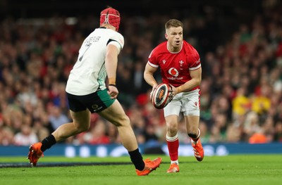 220225  Wales v Ireland, 2025 Guinness Six Nations - Gareth Anscombe of Wales takes on Josh van der Flier of Ireland