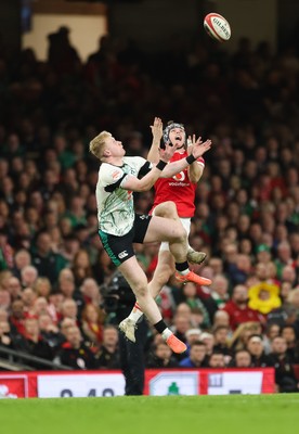 220225  Wales v Ireland, 2025 Guinness Six Nations - Tom Rogers of Wales beats Jamie Osborne of Ireland to take the ball