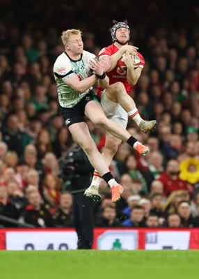 220225  Wales v Ireland, 2025 Guinness Six Nations - Tom Rogers of Wales beats Jamie Osborne of Ireland to take the ball