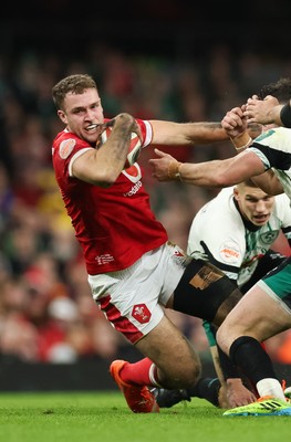 220225  Wales v Ireland, 2025 Guinness Six Nations - Max Llewellyn of Wales is tackled