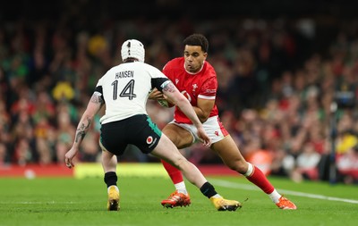 220225  Wales v Ireland, 2025 Guinness Six Nations - Ben Thomas of Wales takes on Mack Hansen of Ireland