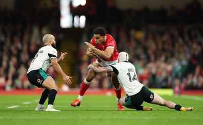 220225  Wales v Ireland, 2025 Guinness Six Nations - Ben Thomas of Wales takes on Mack Hansen of Ireland