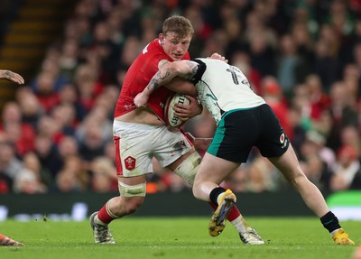 220225  Wales v Ireland, 2025 Guinness Six Nations - Jac Morgan of Wales takes on Mack Hansen of Ireland’