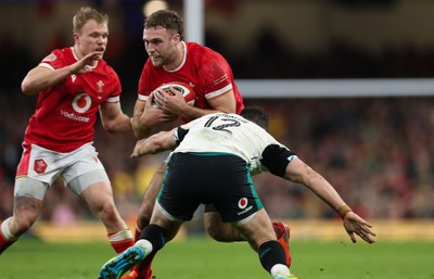 220225  Wales v Ireland, 2025 Guinness Six Nations - Max Llewellyn of Wales takes on Robbie Henshaw of Ireland