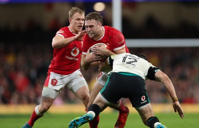 220225  Wales v Ireland, 2025 Guinness Six Nations - Max Llewellyn of Wales takes on Robbie Henshaw of Ireland