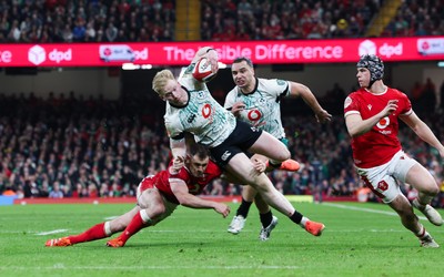 220225  Wales v Ireland, 2025 Guinness Six Nations - Jamie Osborne of Ireland is tackled by Tomos Williams of Wales