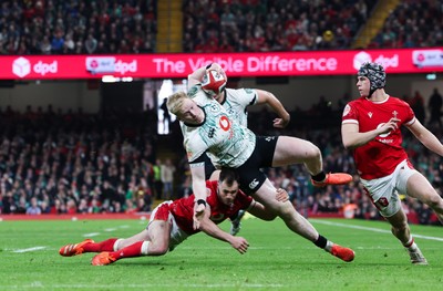 220225  Wales v Ireland, 2025 Guinness Six Nations - Jamie Osborne of Ireland is tackled by Tomos Williams of Wales