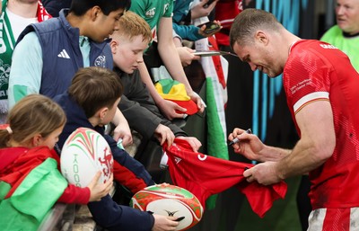 220225  Wales v Ireland, 2025 Guinness Six Nations - Will Rowlands of Wales signs autographs at the end of the match