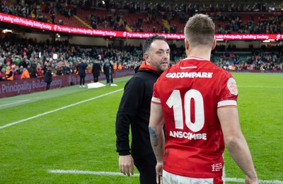 220225  Wales v Ireland, 2025 Guinness Six Nations - Wales interim head coach Matt Sherratt with Gareth Anscombe of Wales at the end of the match