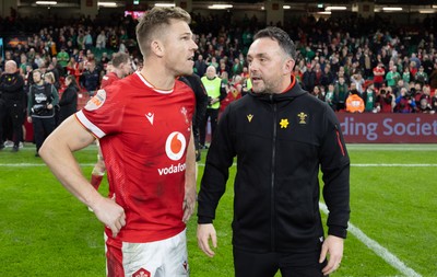 220225  Wales v Ireland, 2025 Guinness Six Nations - Wales interim head coach Matt Sherratt with Gareth Anscombe of Wales at the end of the match