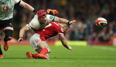 220225  Wales v Ireland, 2025 Guinness Six Nations - Josh van der Flier of Ireland loses the ball as he goes over Tomos Williams of Wales