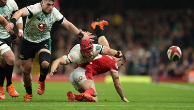 220225  Wales v Ireland, 2025 Guinness Six Nations - Josh van der Flier of Ireland loses the ball as he goes over Tomos Williams of Wales