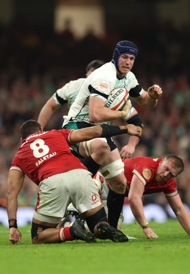 220225  Wales v Ireland, 2025 Guinness Six Nations - Cian Prendergast of Ireland takes on Taulupe Faletau of Wales