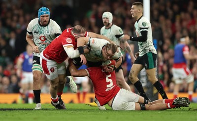 220225  Wales v Ireland, 2025 Guinness Six Nations - Finlay Bealham of Ireland is tackled by Dafydd Jenkins of Wales and Henry Thomas of Wales