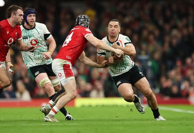 220225  Wales v Ireland, 2025 Guinness Six Nations - James Lowe of Ireland takes on Tom Rogers of Wales