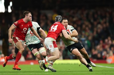 220225  Wales v Ireland, 2025 Guinness Six Nations - James Lowe of Ireland takes on Tom Rogers of Wales