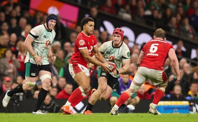 220225  Wales v Ireland, 2025 Guinness Six Nations - Ben Thomas of Wales feeds Jac Morgan of Wales