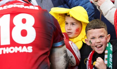 220225  Wales v Ireland, 2025 Guinness Six Nations - Henry Thomas of Wales signs autographs at the end of the match